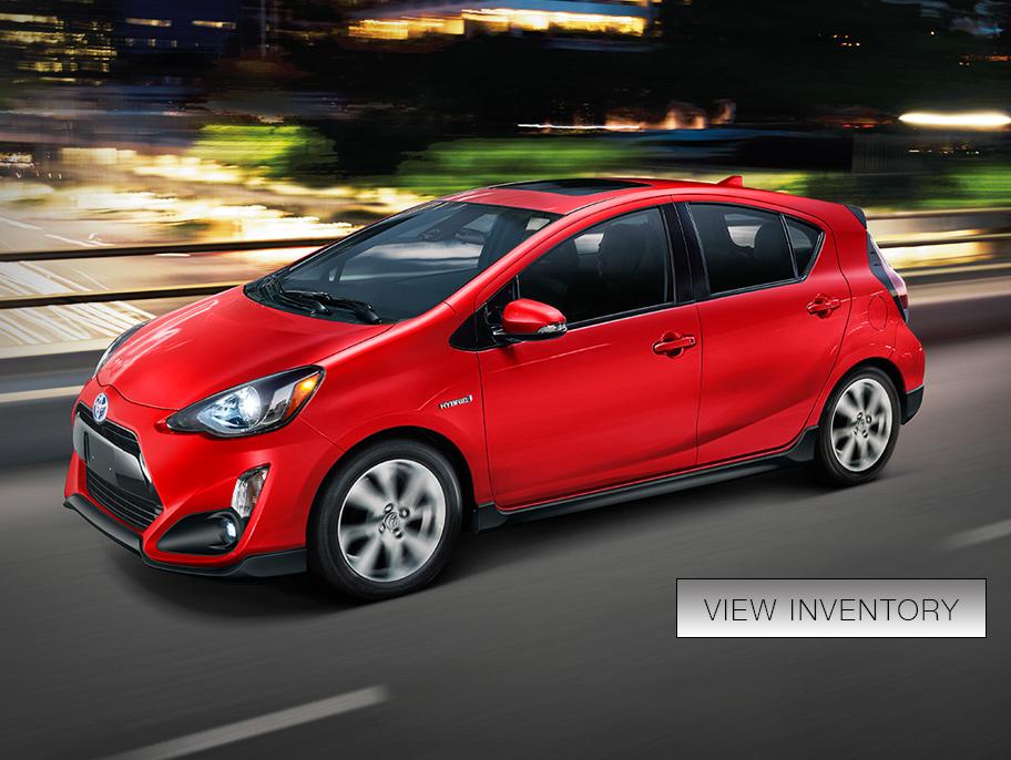 Prius c driving in the city. Prius c driving in the city.