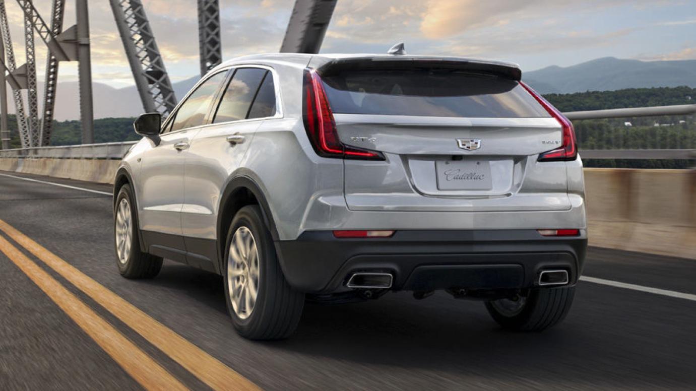 Sliver Cadillac XT4 driving on a bridge