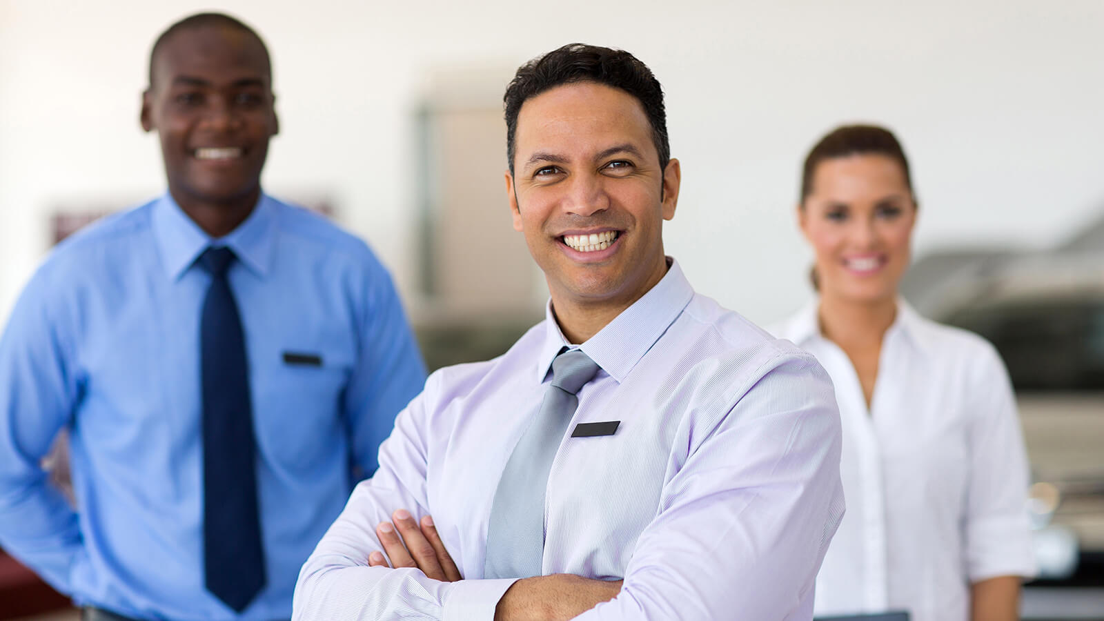 Smiling dealership associates