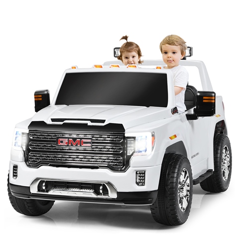 Kids riding in a mini battery powered GMC Sierra 1500 