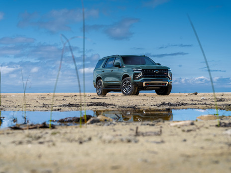 The 2025 Chevy Tahoe parked in a muddy area