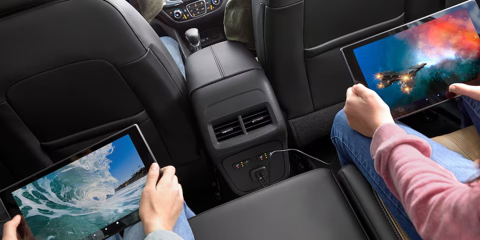 Children playing on tablets inside the 2024 Chevrolet Equinox