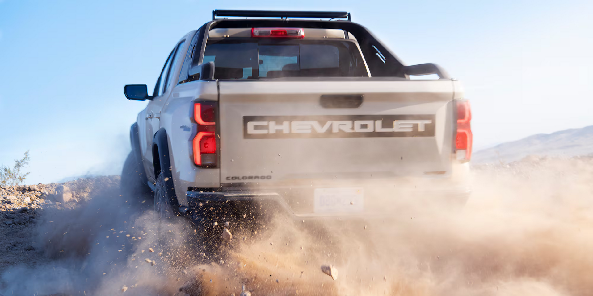 The 2025 Chevrolet Colorado driving through dirt