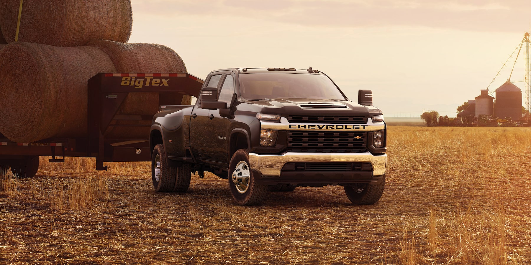 The 2023 Chevrolet Silverado HD hauling bales of hay