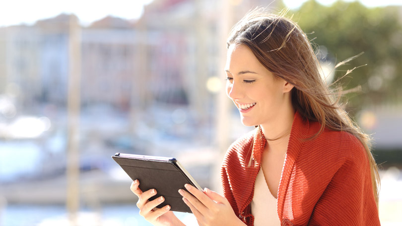 woman shopping on tablet