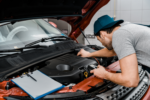 Man charging a car battery