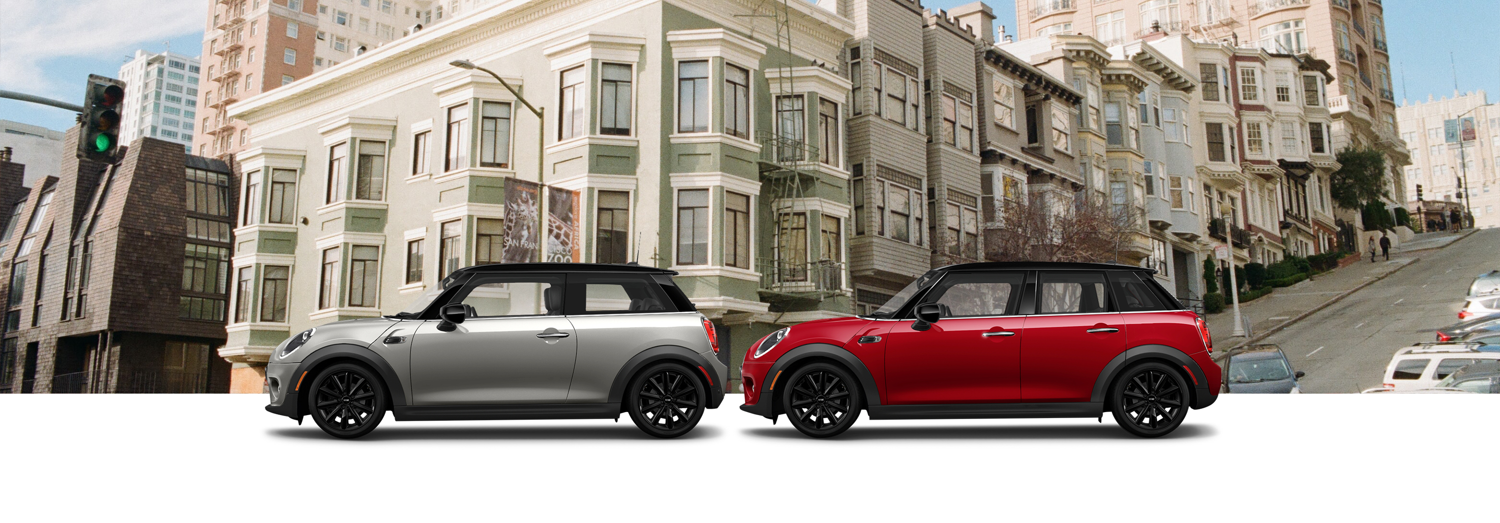 Oxford Edition MINI Cooper Hardtop 2 Door and Oxford Edition MINI Cooper Hardtop 4 Door in front of residential area of a city.