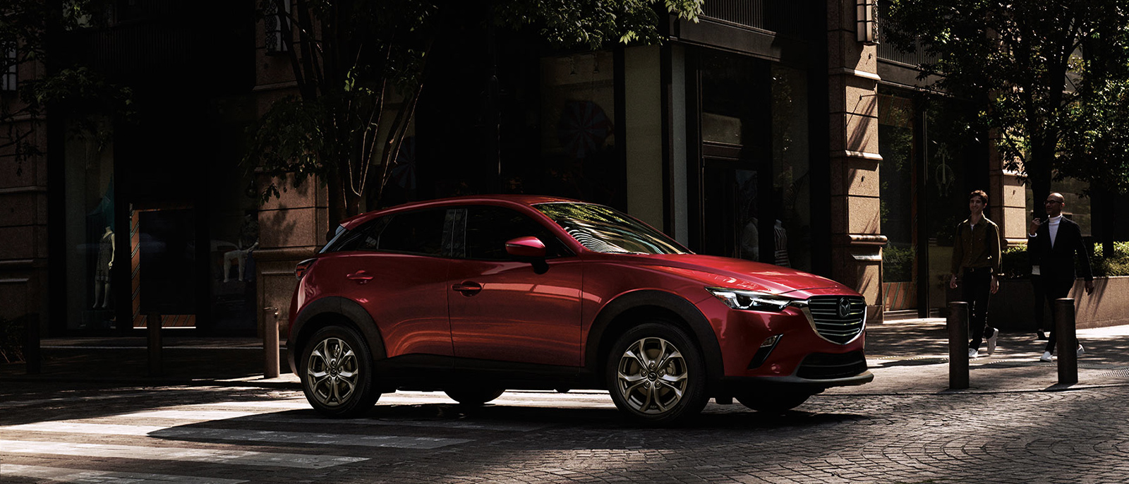 Red Mazda CX-3 parked in a street