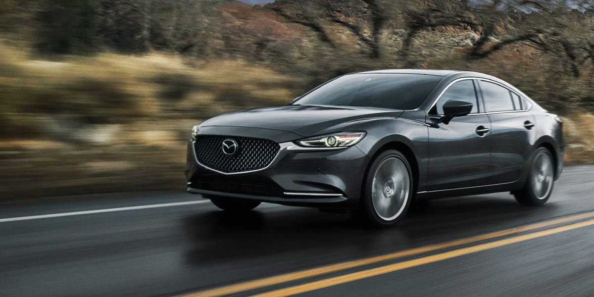 A 2020 Mazda6 driving on a road