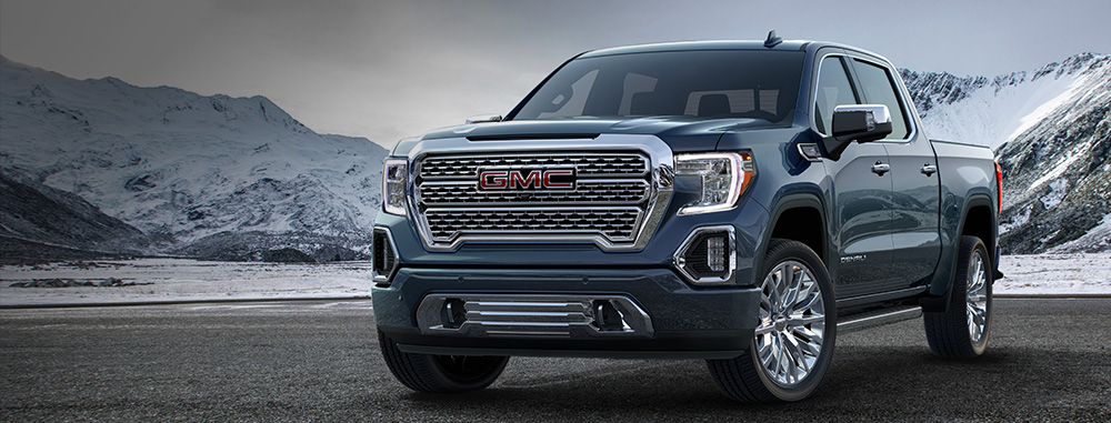 2019 GMC Sierra 1500 Denali on display in front of mountains