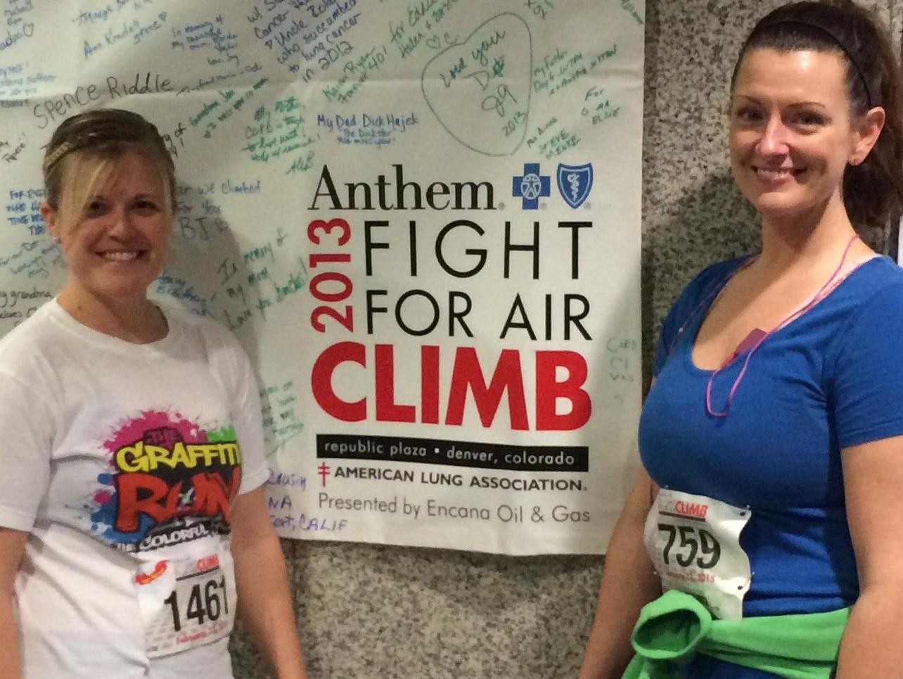 Stacey (left) & Tina next to a tribute board from a previous year's climb