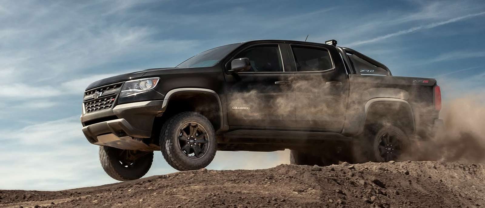 A Black 2019 Chevy Colorado in a mountain dust.