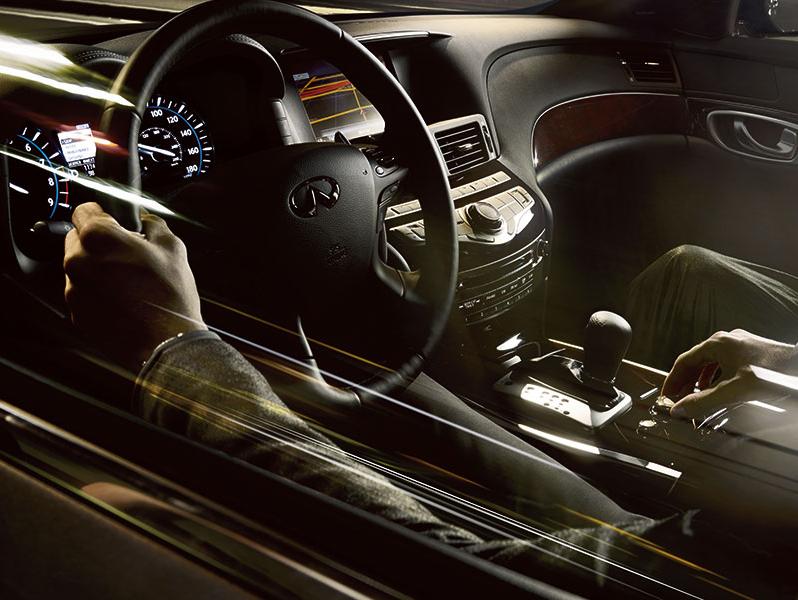 2016 INFINITI Q70 interior view of man driving 2016 INFINITI Q70 interior view of man driving