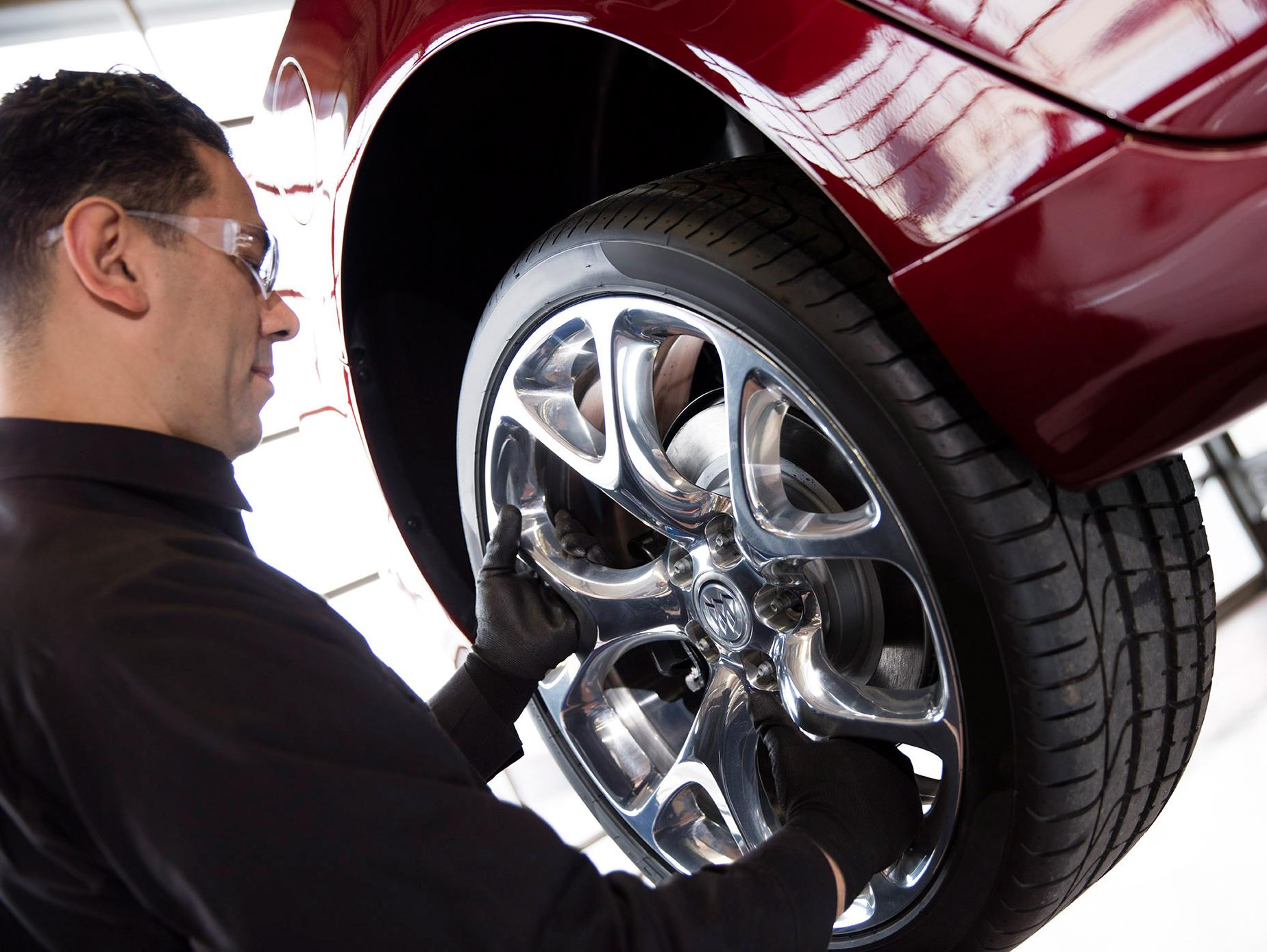 Buick Tech installs tire Buick Tech installs tire