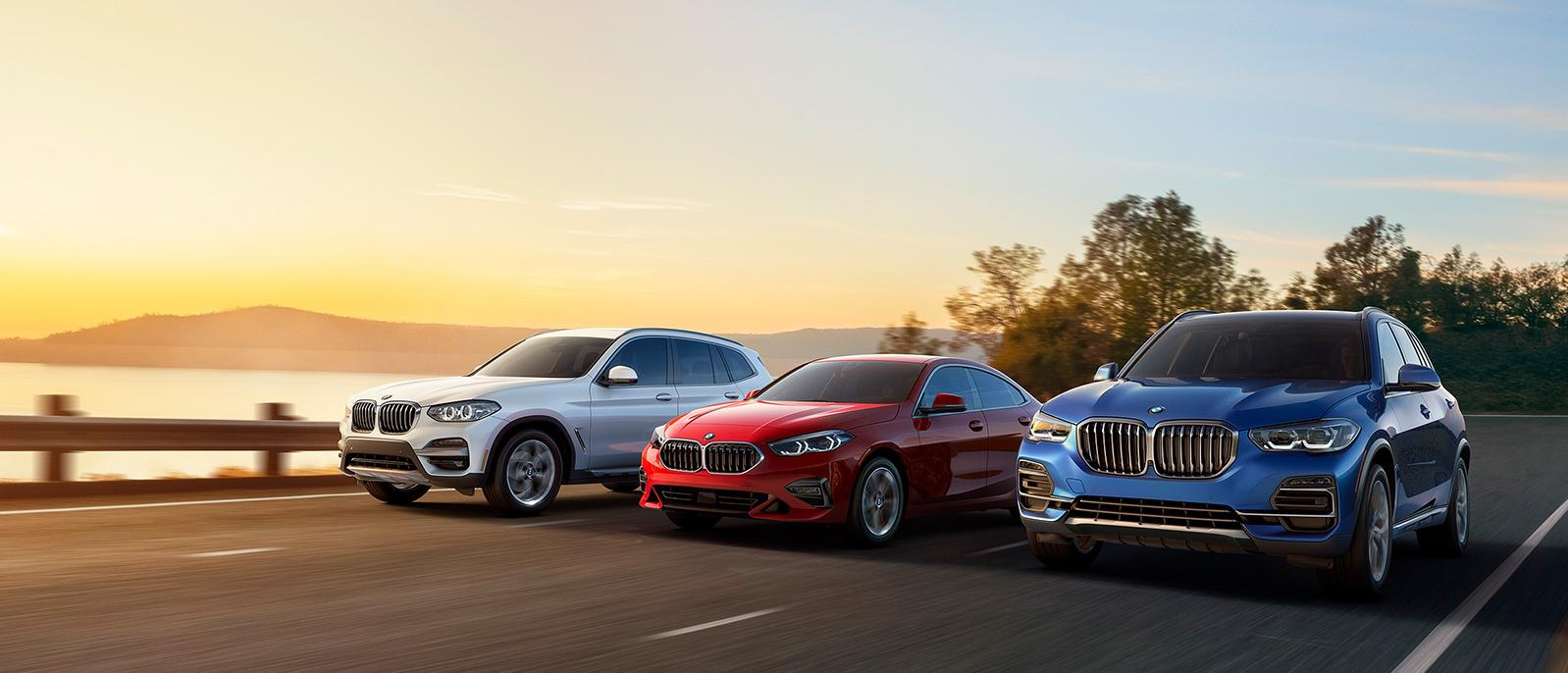 BMW group packshot of vehicles driving down road