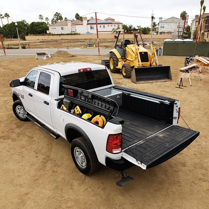 A white RAM Crew Cab at a construction site.