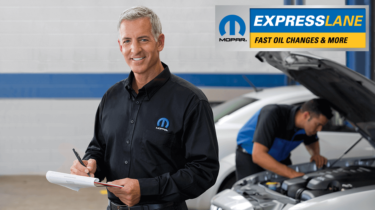 Mopar Service Technician holding a clipboard.