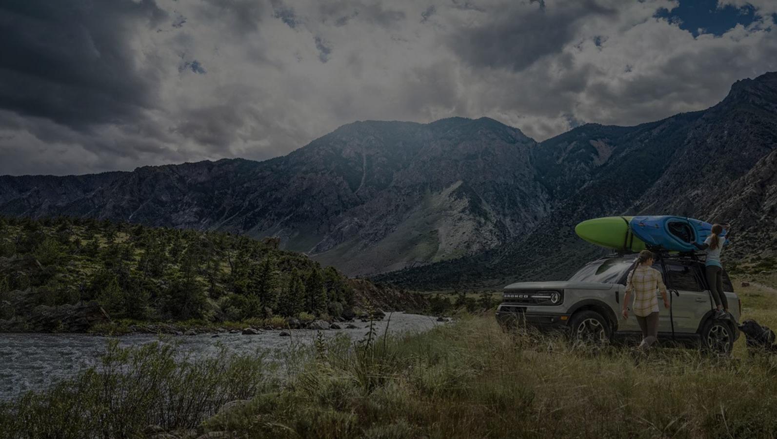 2021 Bronco Sport In the Mountains with 2 people with kayaks
