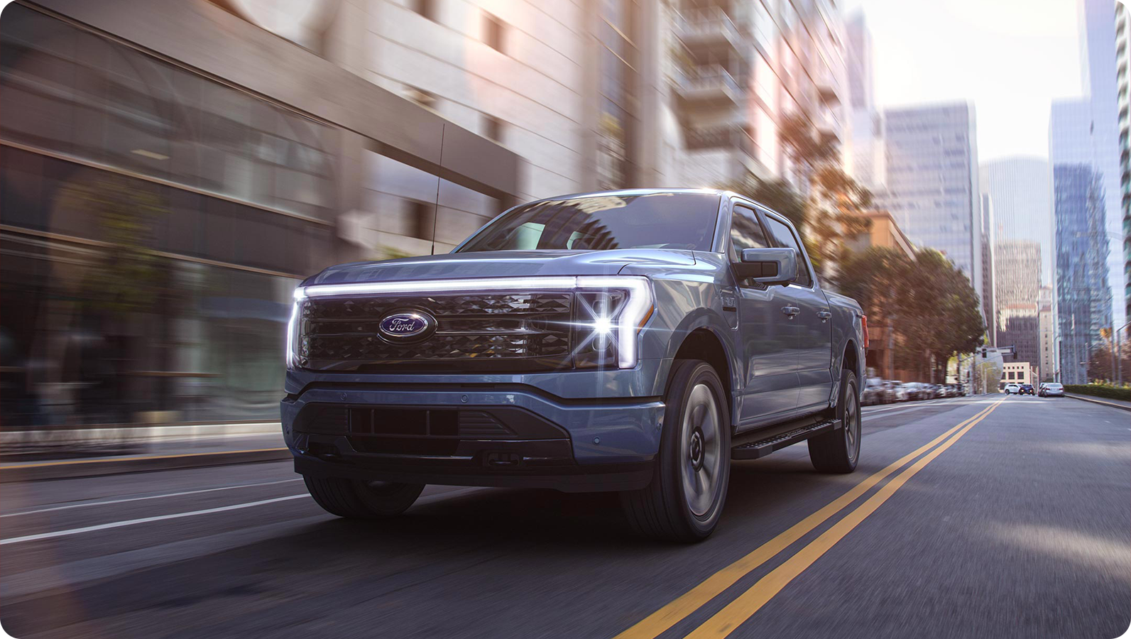 An F-150 Lightning being driven in the city