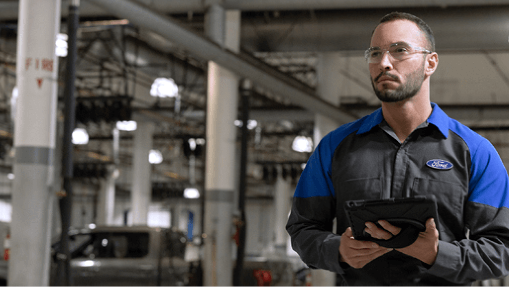 Service technician with tablet in hand