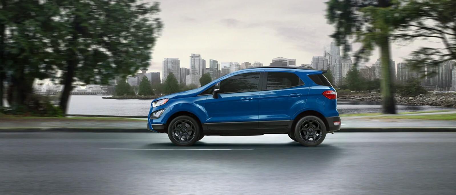 Blue Ford Ecosport driving on the road. Blue Ford Ecosport driving on the road.