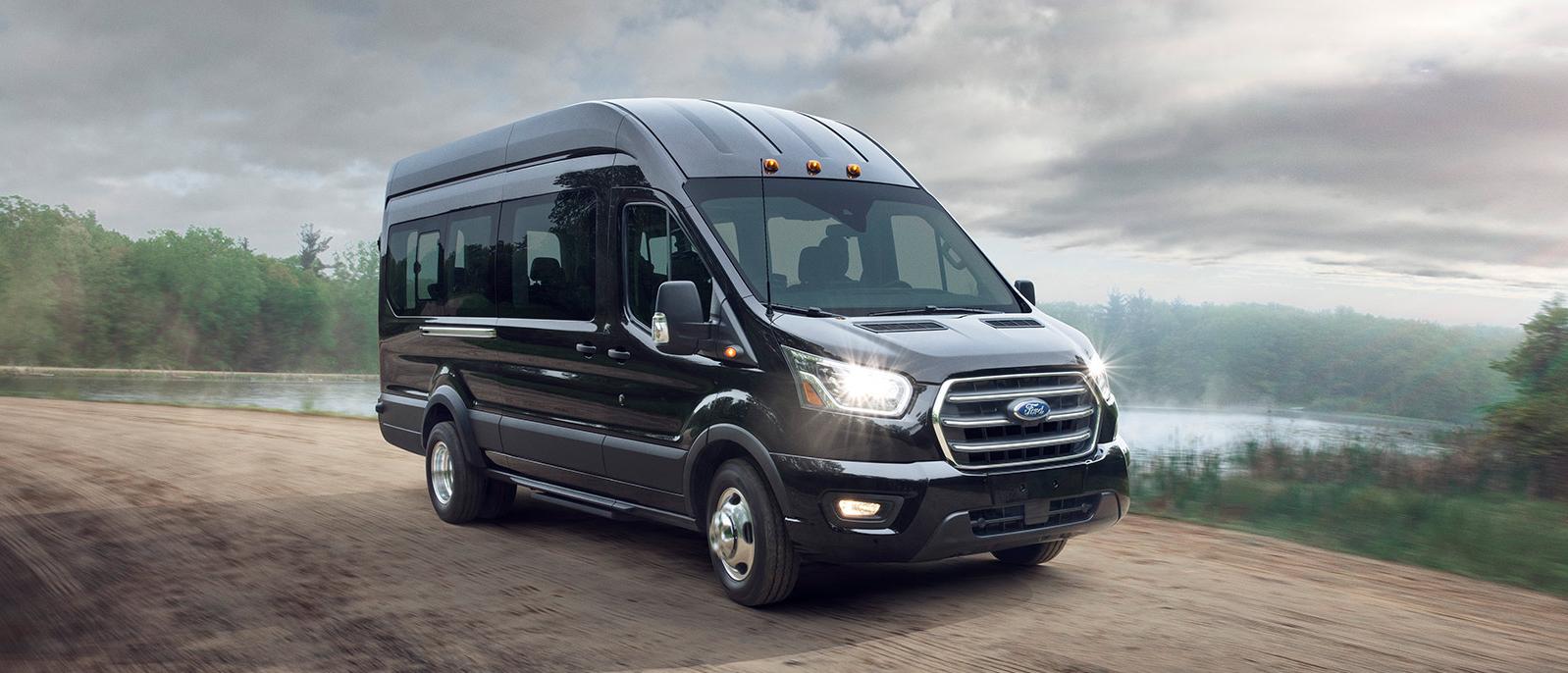 A 2022 Ford Transit Van is sprinting on the road. A 2022 Ford Transit Van is sprinting on the road.