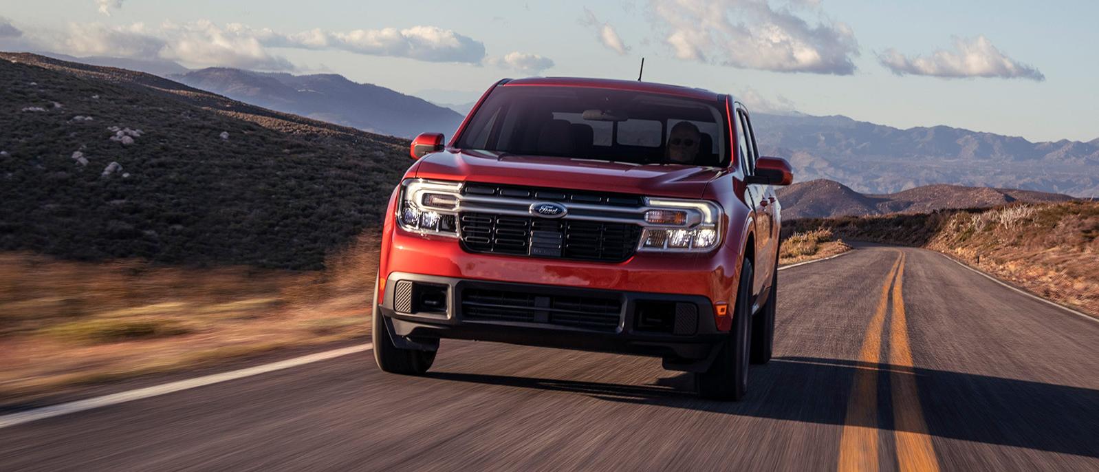 2022 red Ford Maverick is running on the road. 2022 red Ford Maverick is running on the road.