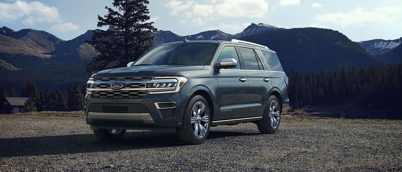 2022 Ford Expedition is parked on the land with mountains scenarios in the background. 2022 Ford Expedition is parked on the land with mountains scenarios in the background.