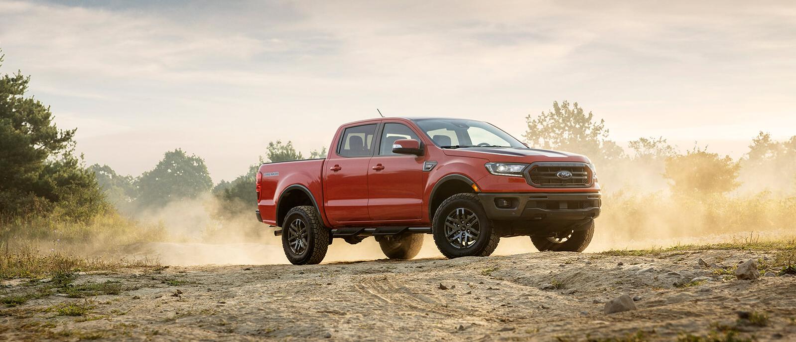 Red 2021 Ford Ranger parked on a barren land. Red 2021 Ford Ranger parked on a barren land.