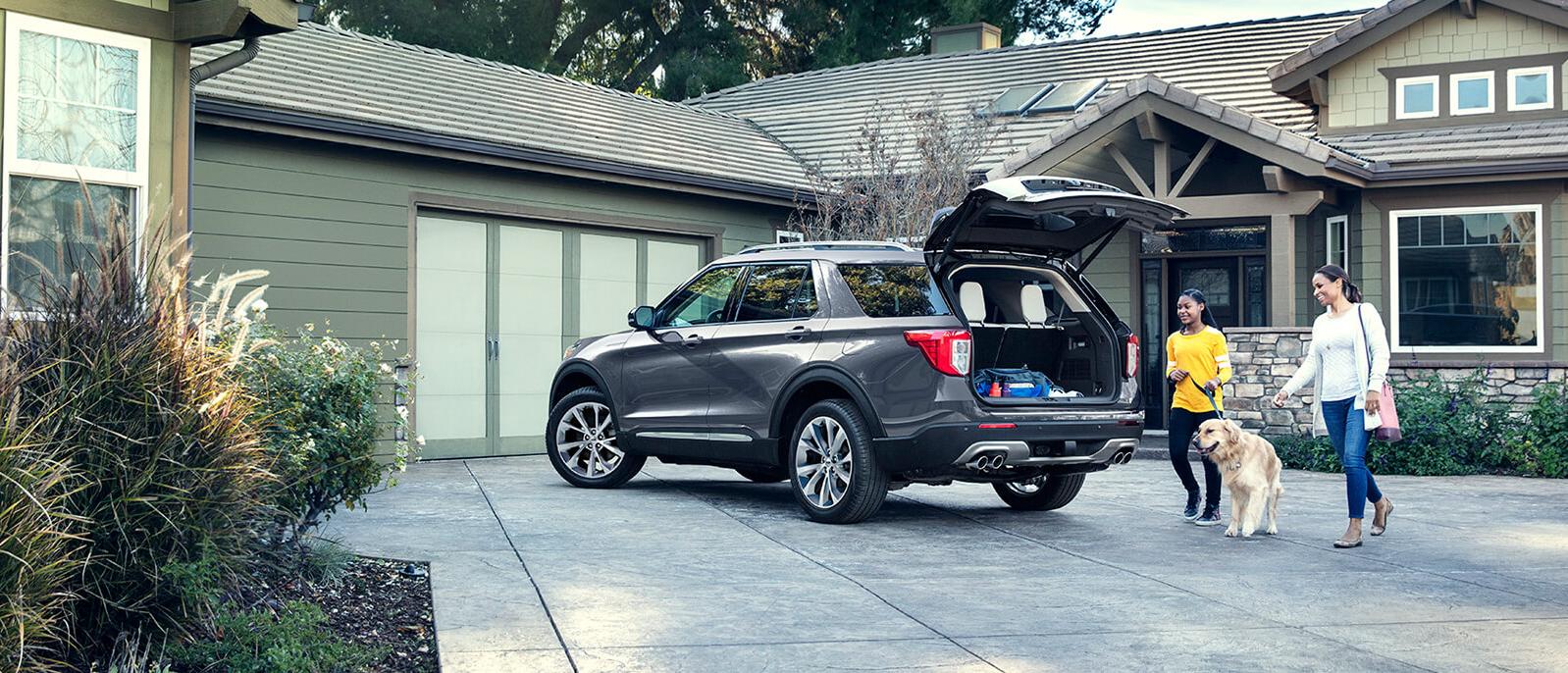 Grey 2021 Ford Explorer parke in front of a house. Grey 2021 Ford Explorer parke in front of a house.