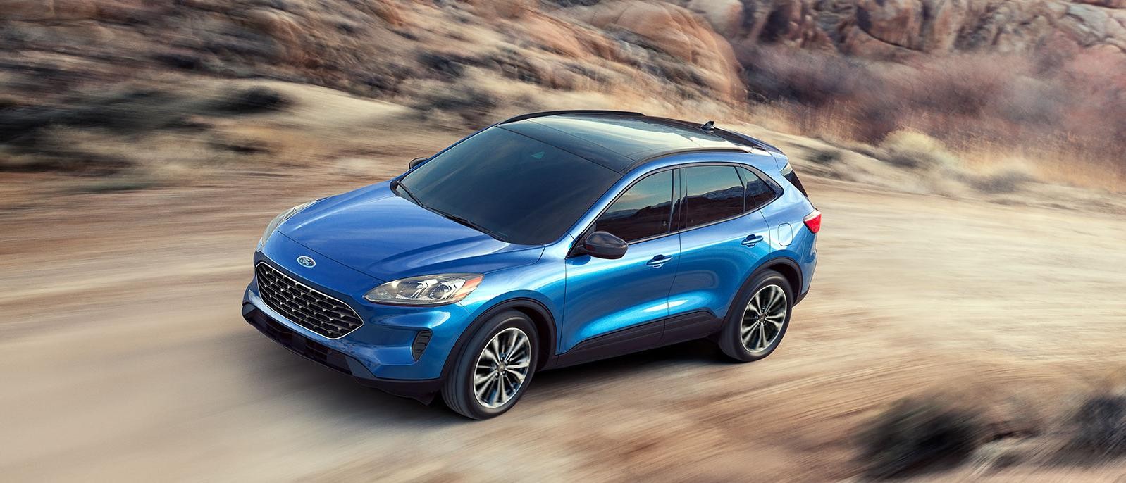 2022 Ford Escape driving on a mountain road.