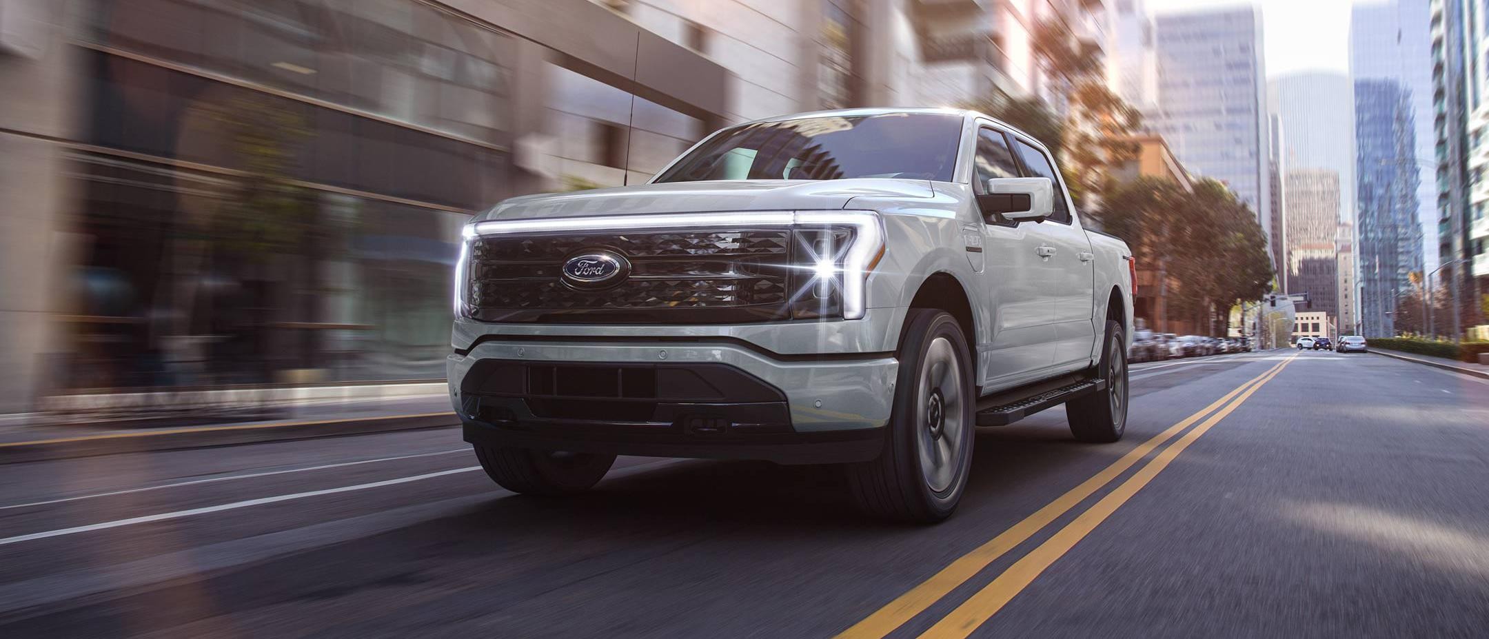 An F-150 Lightning® truck being driven in the city