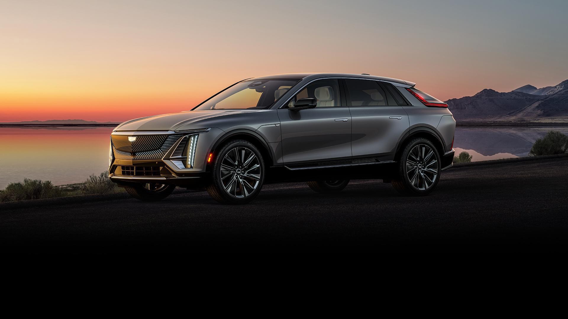 2023 Cadillac Lyriq parked on road with sunset in background