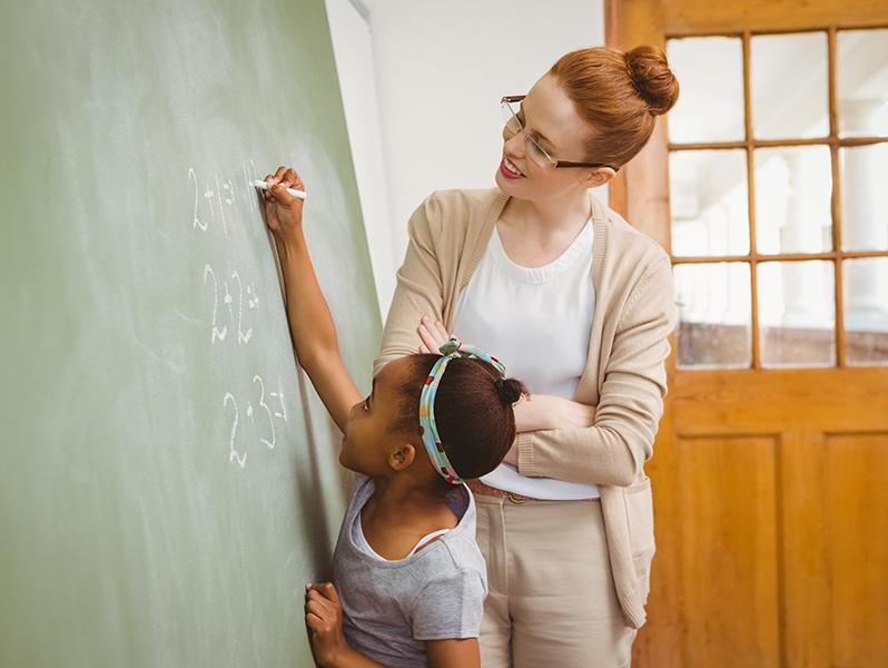 Teacher and student in classroom