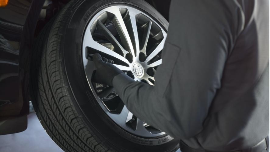 Buick Protection Service Expert Checking Tire