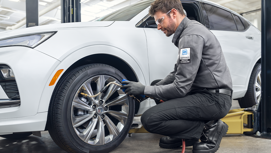 Buick Protection Service Expert Checking Tire