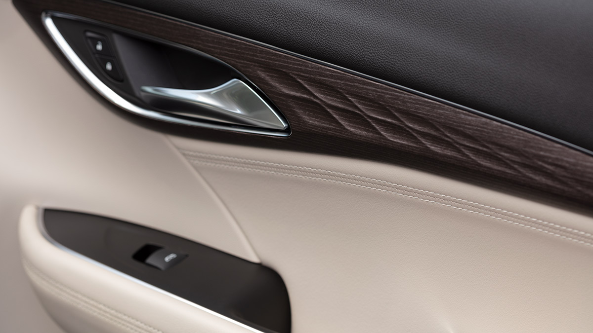 Detail view of the fit and finish of the Buick Envision interior door.