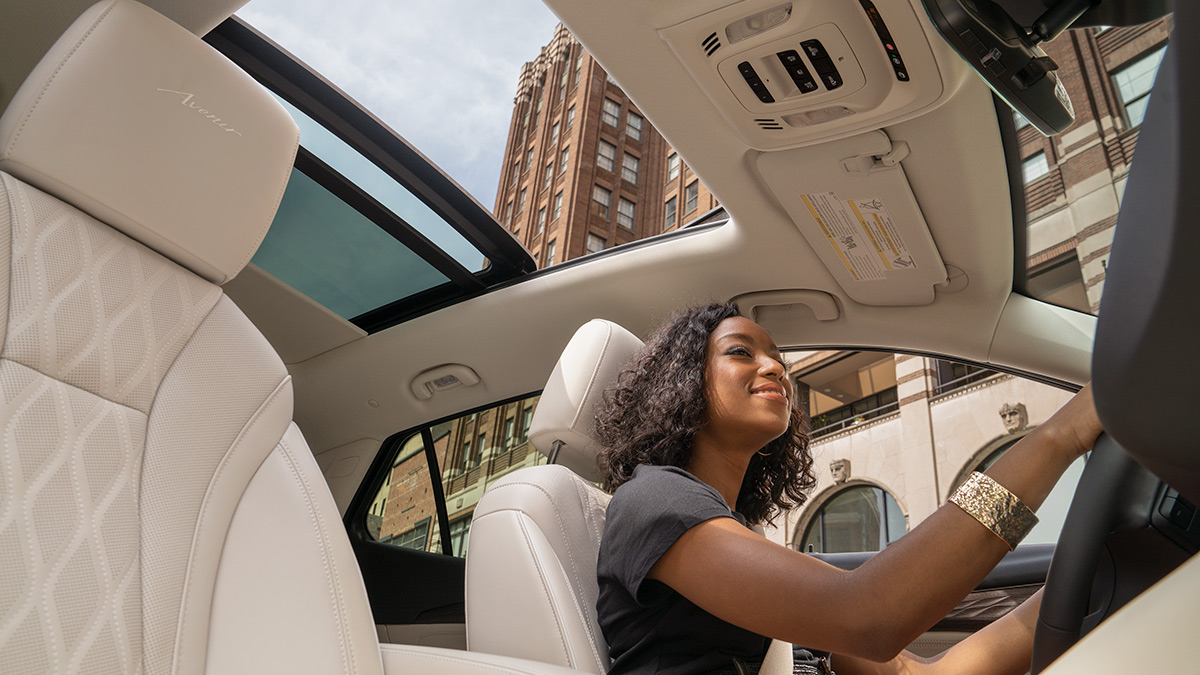 Upward view of the interior of a Buick Envision featuring the sunroof.