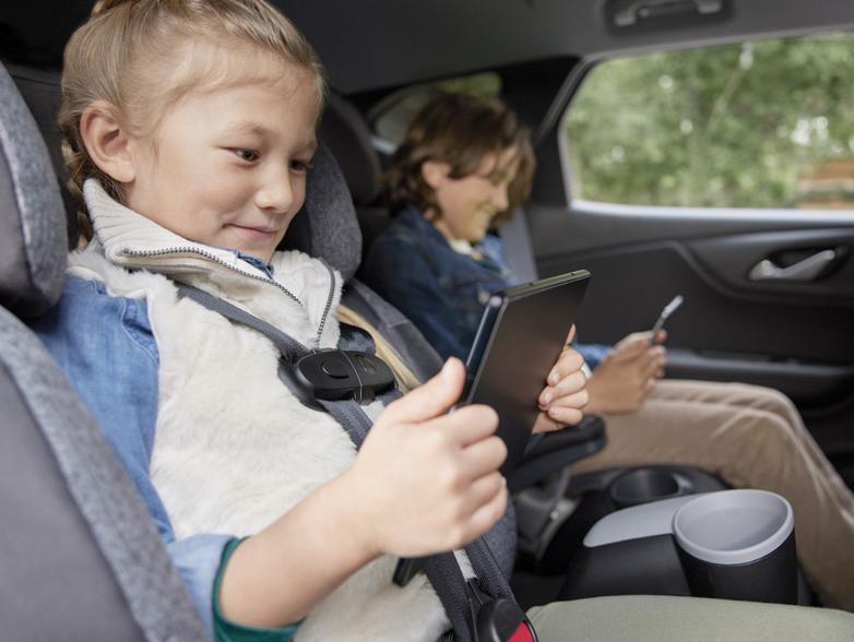 2 kids in the backseat of a buick on tablets 2 kids in the backseat of a buick on tablets