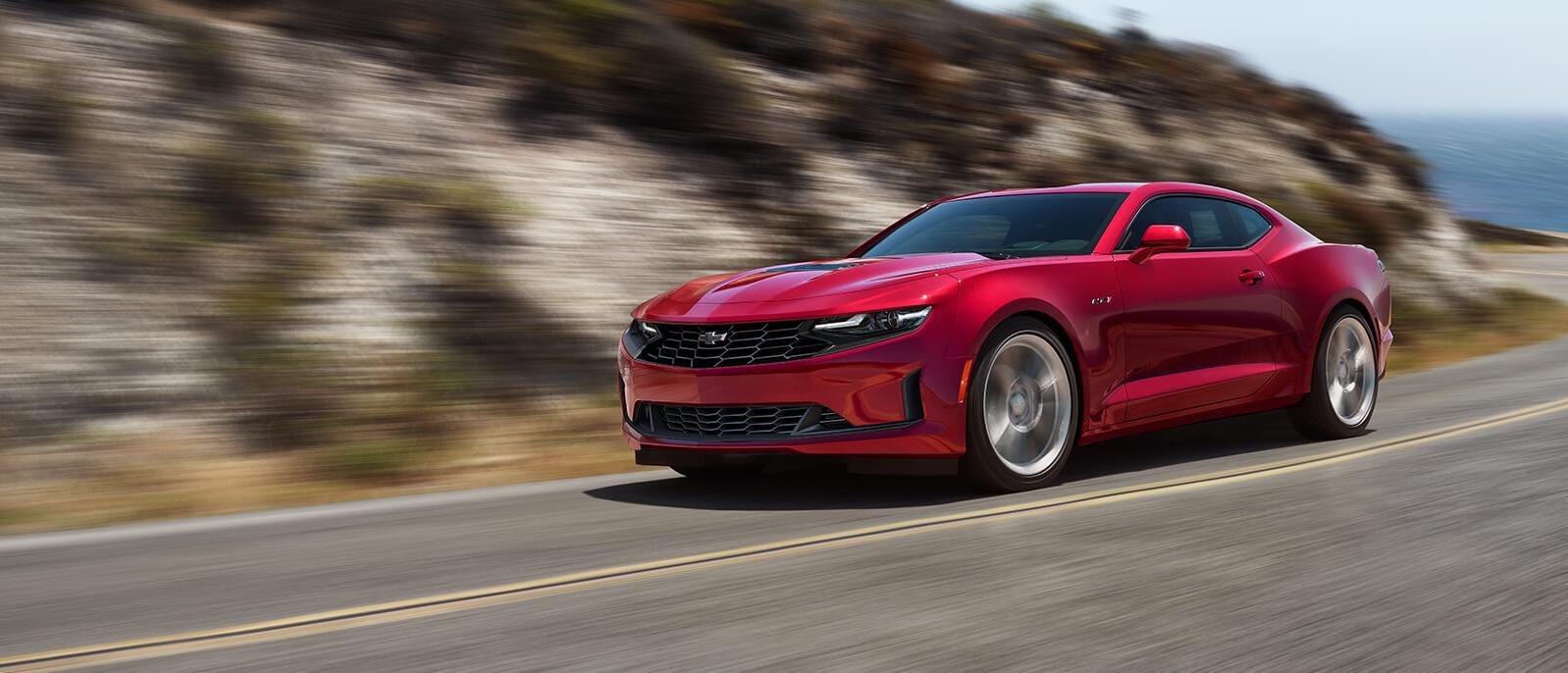 2021 Chevy Camaro driving through the mountain road. 2021 Chevy Camaro driving through the mountain road.