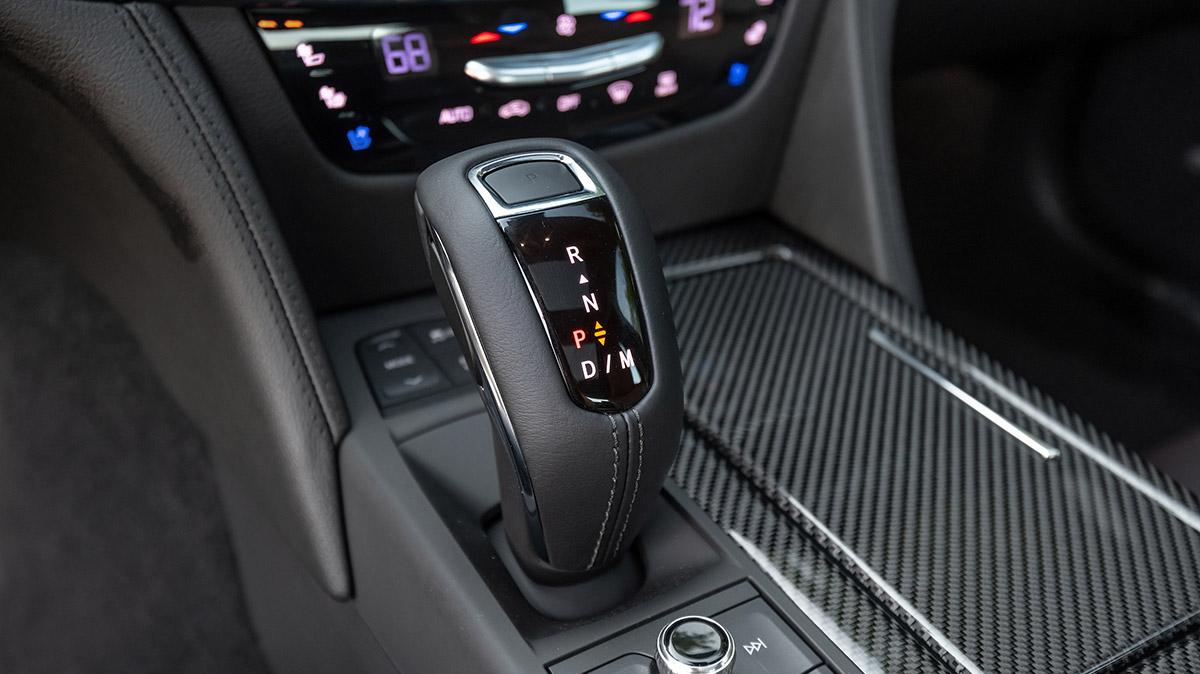 Detail view of the carbon fiber and leather accents of the center console on a 2020 Cadillac CT6.