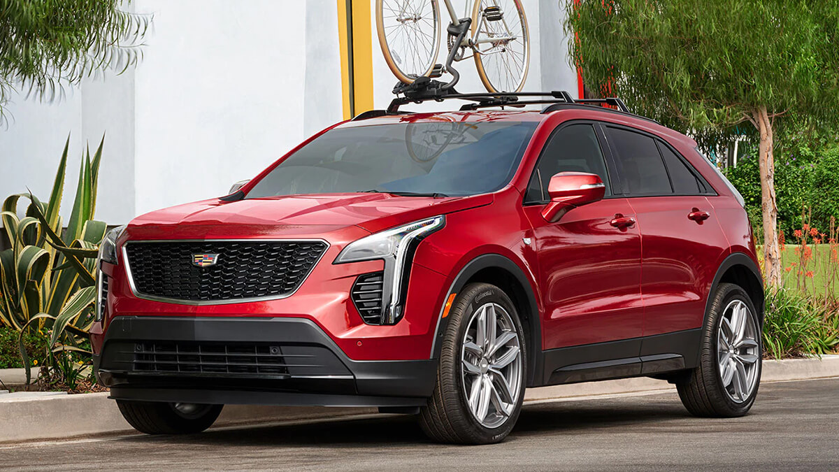 Red XT4 parked outside a house.