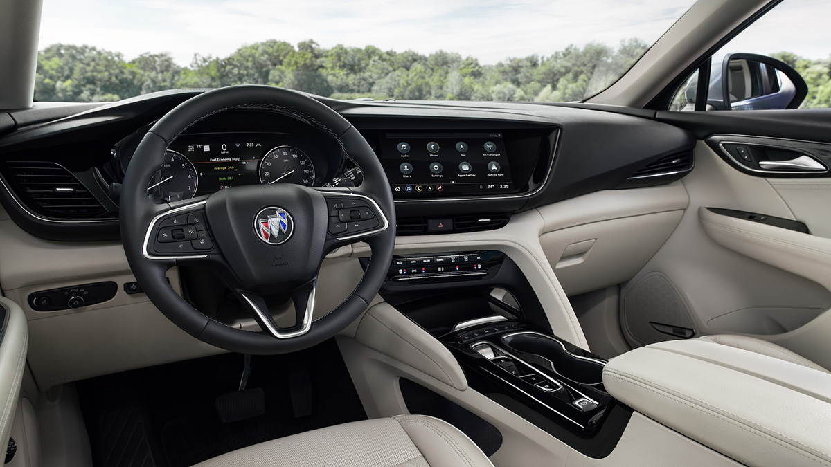 Interior view of a Buick Envision front seats and dashboard.