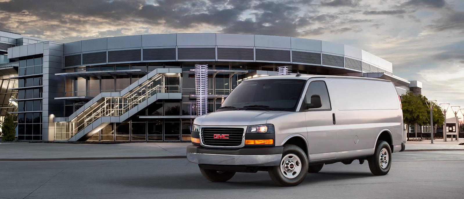 A 2021 GMC Savana Cargo van in the parking lot of a venue. A 2021 GMC Savana Cargo van in the parking lot of a venue.