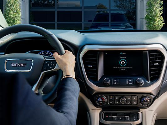 Woman Driving Car with Alexa on display screen Woman Driving Car with Alexa on display screen