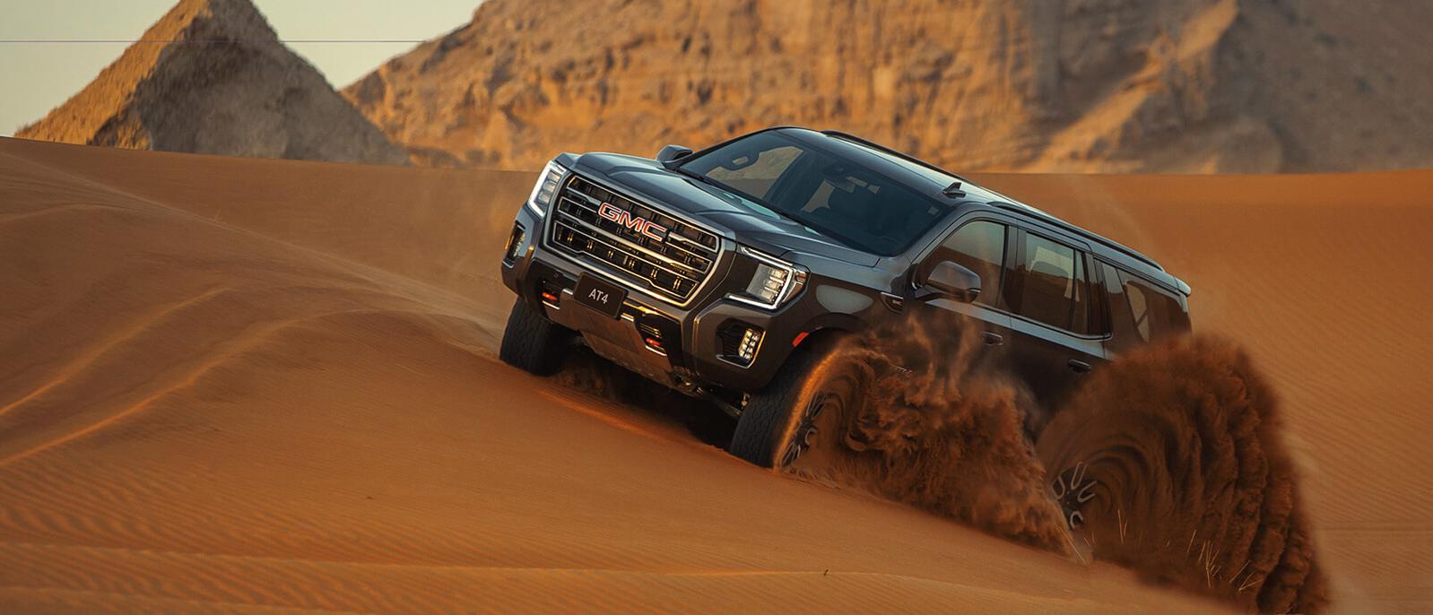 A 2021 GMC Yukon cruising in the desert A 2021 GMC Yukon cruising in the desert