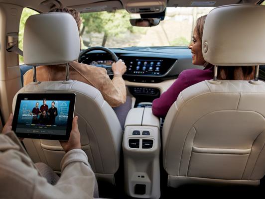 Family in Buick Car with tablet in the back streaming Family in Buick Car with tablet in the back streaming