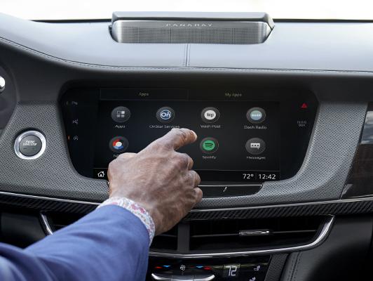 Man pushing app button on display