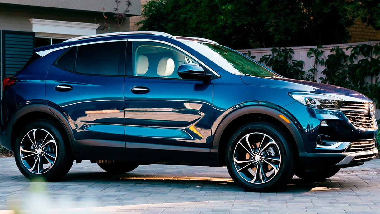 2021 Blue Encore GX parked in front of a house.