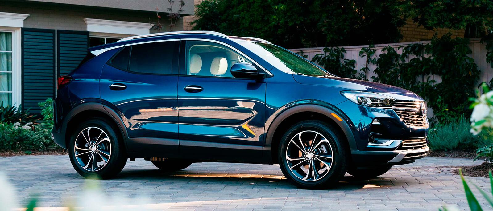 2021 Blue Encore GX parked in front of a house. 2021 Blue Encore GX parked in front of a house.